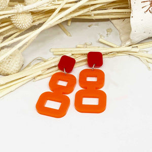 Bebe Red Earbutton and Orange Shape