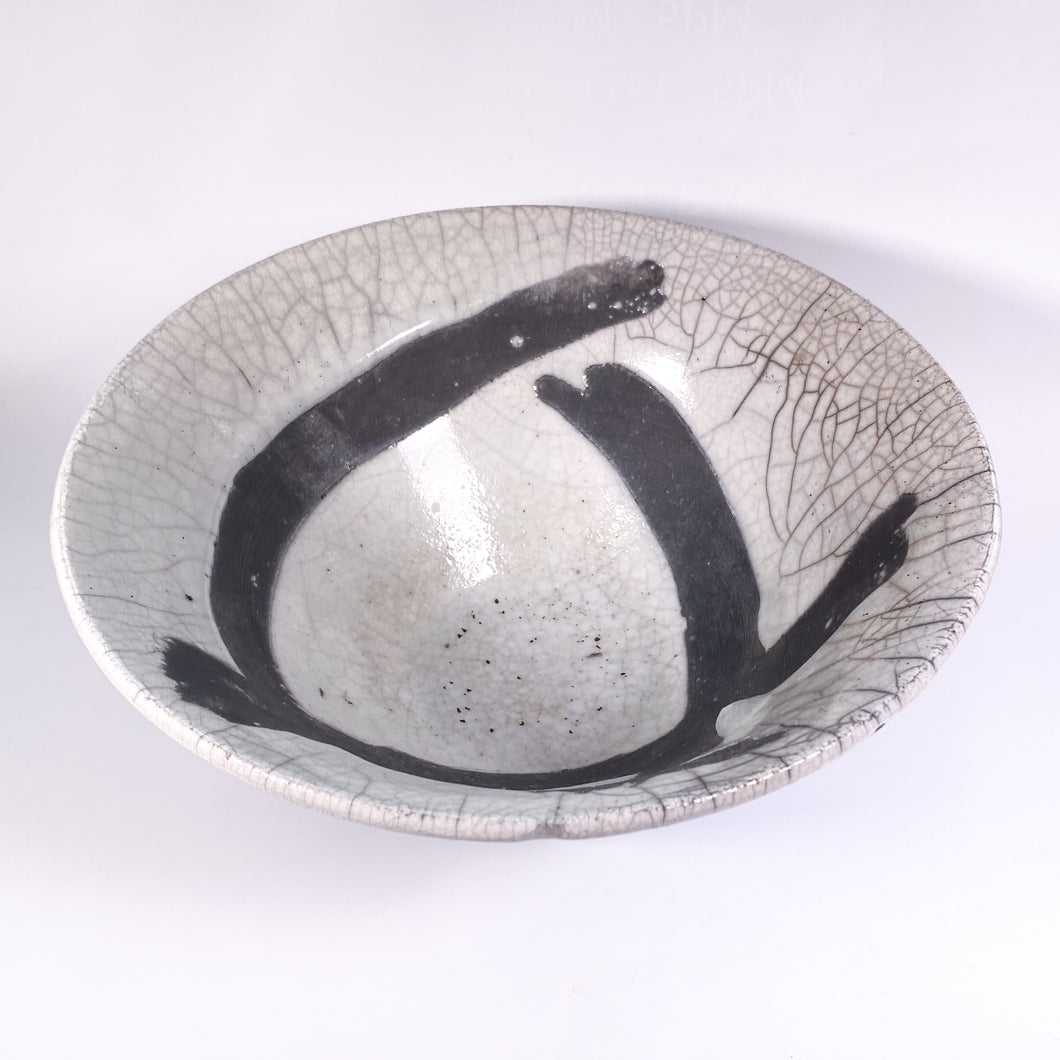 White Bowl With Black Stripes by Pat Boow.