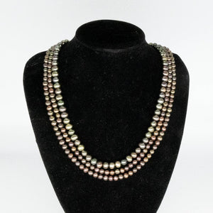 Necklace With Triple Strand of Greenish/Brown Pearls.